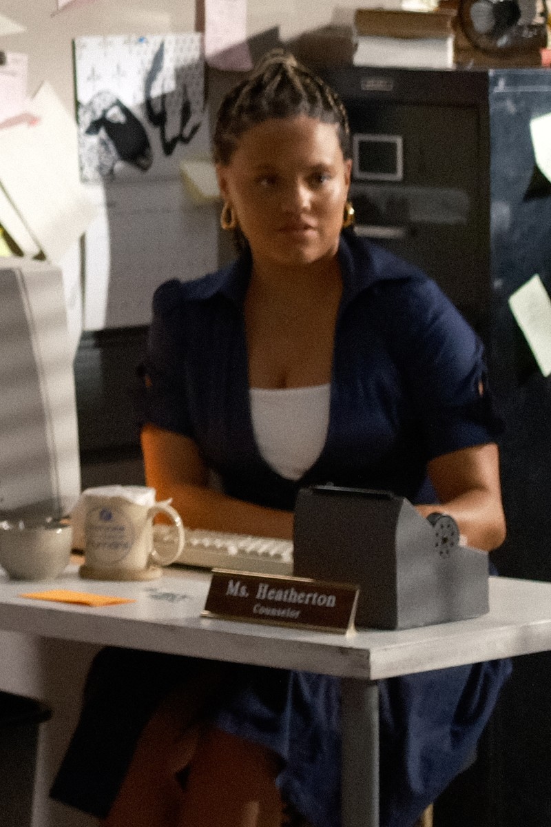 Sarah Jeffery as Ms. Heatherton, the prison counselor, at her office desk
