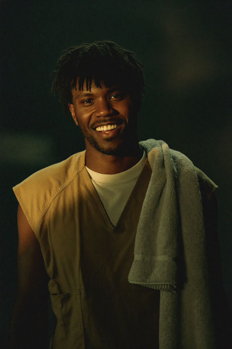 Concept portrait of Tee, a young inmate with an easy half-grin