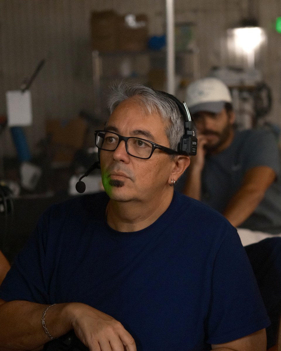 Director of photography David K. Hauver on headset at the volume's video village, watching the take